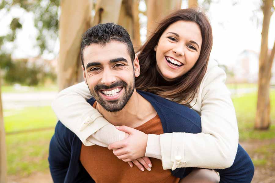Smiling couple with healthy teeth
